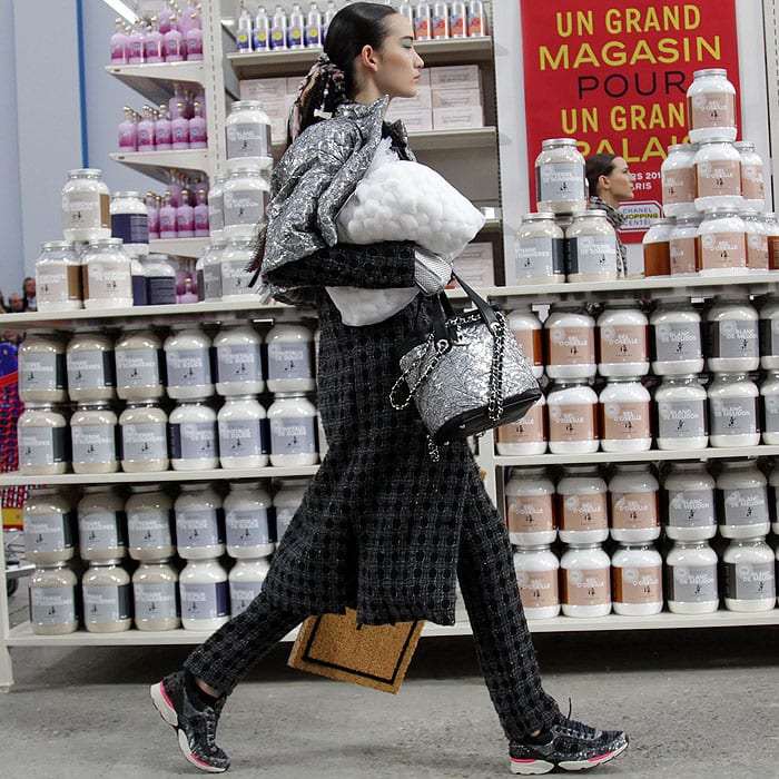 A model walking in the Chanel fall 2014 fashion presentation at the Grand Palais in Paris