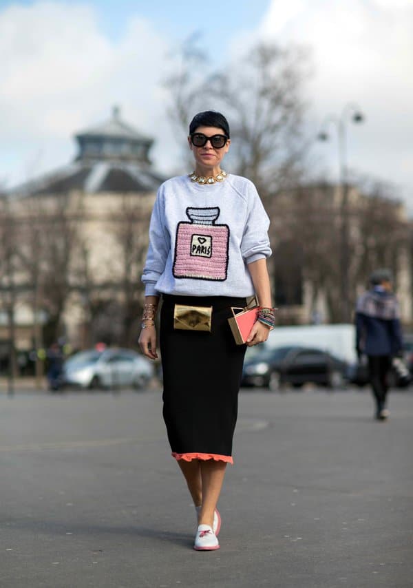 Elisa Nalin in a black pencil skirt with statement accessories