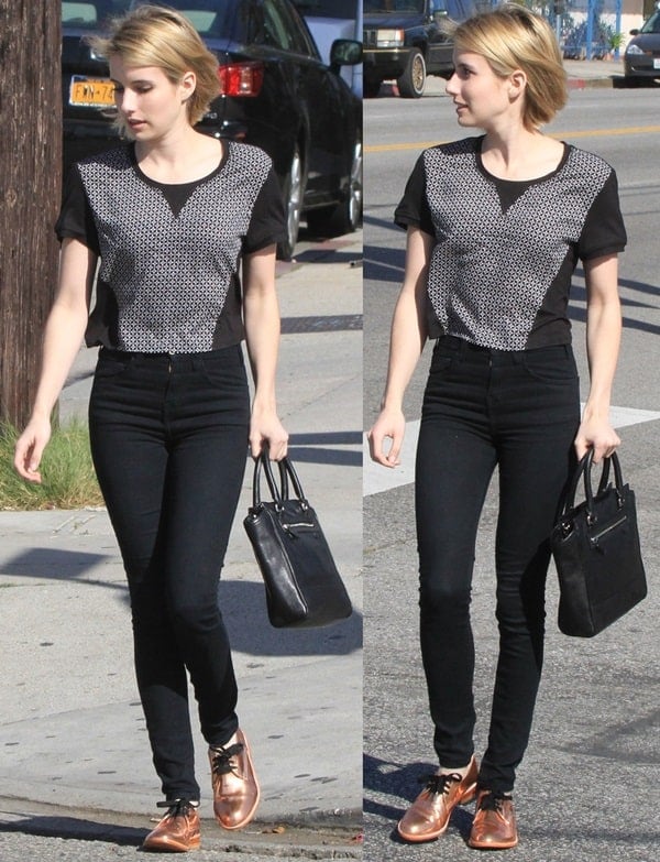 Emma Roberts wears a patterned top and copper shoes