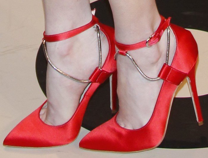 Emma Roberts's feet in red satin Brian Atwood pumps