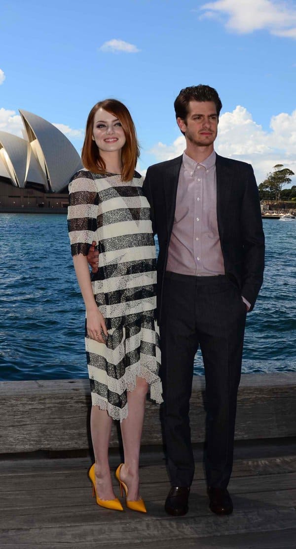 Despite Emma Stone's 4-inch yellow Louboutin heels, Andrew Garfield remains taller at the 'The Amazing Spiderman 2' photo call in Sydney