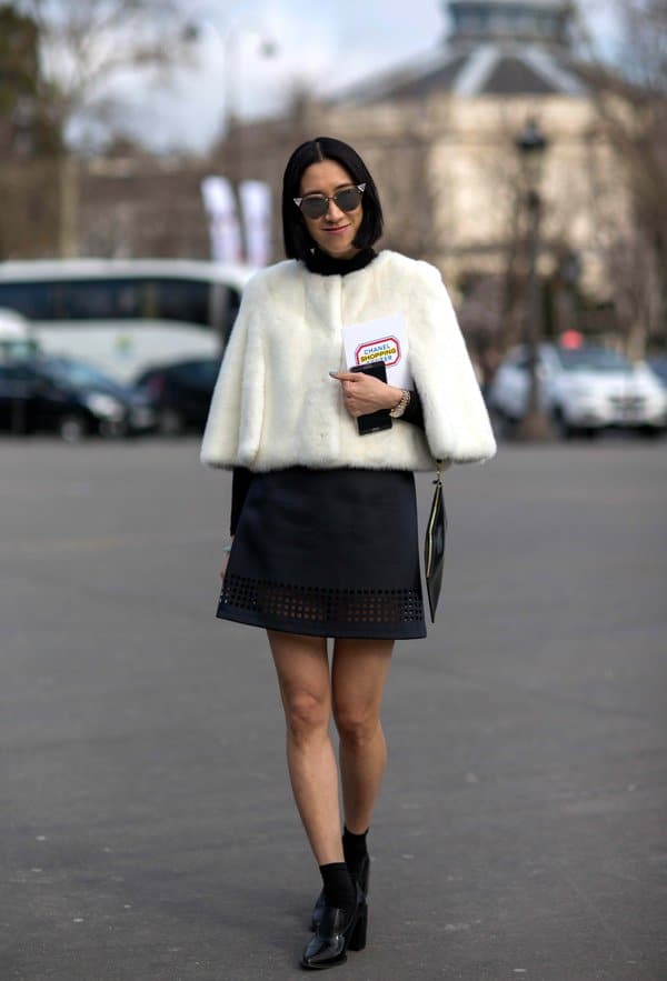 Eva Chen in a perforated A-line skirt and cropped cape