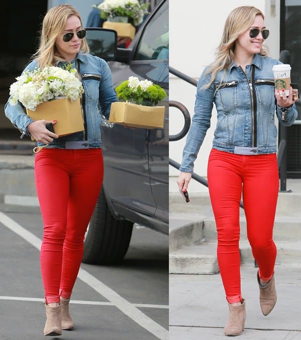 Recreate Hilary Duff’s effortlessly chic look by pairing bold red skinny jeans with a zip-detail denim jacket and beige wedge ankle boots for an easy, stylish day-outfit