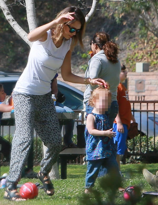 Jessica Alba wears an Aspen cardigan by One Grey Day and floral jog pants by AQUA