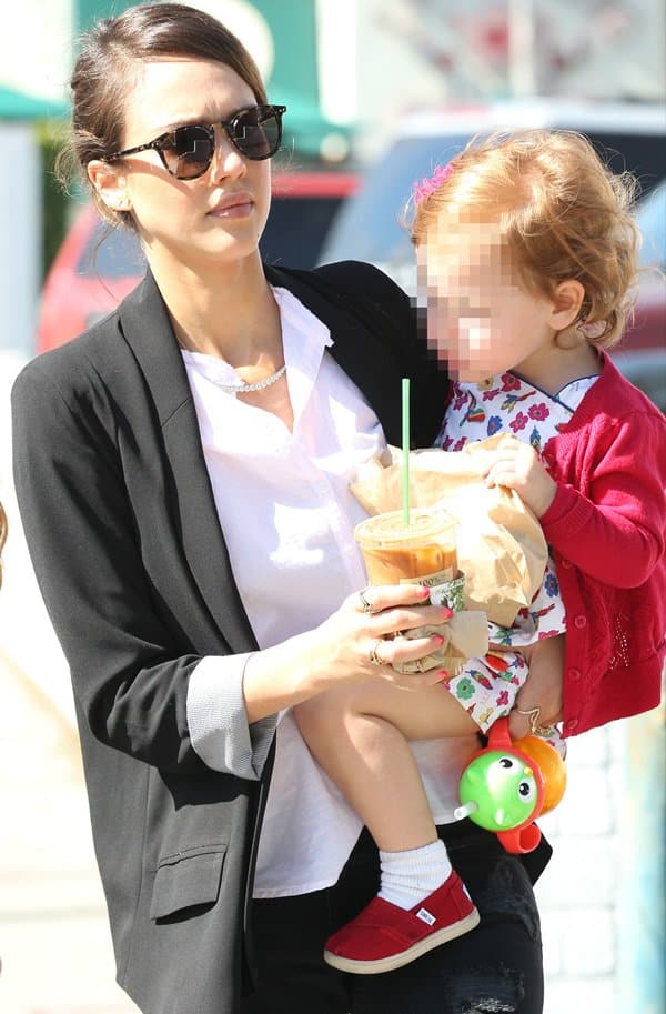 Jessica Alba, exuding effortless sophistication in a tailored blazer and casual chic ensemble, carries daughter Haven as they leave Urth Caffe to shop at Rag & Bone in Los Angeles on Valentine’s Day, February 14, 2014