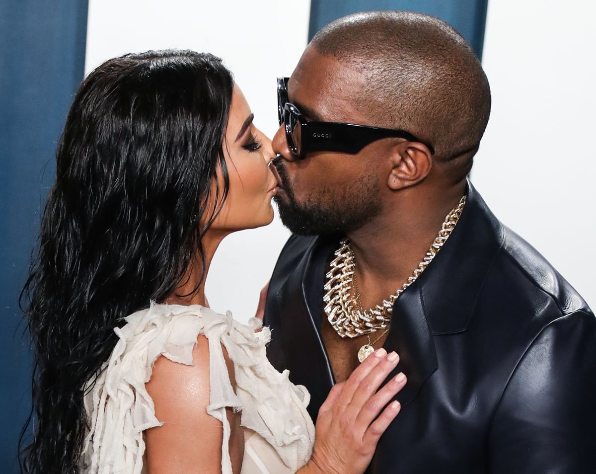 Kim Kardashian West and Kanye West kissing at the 2020 Vanity Fair Oscar Party