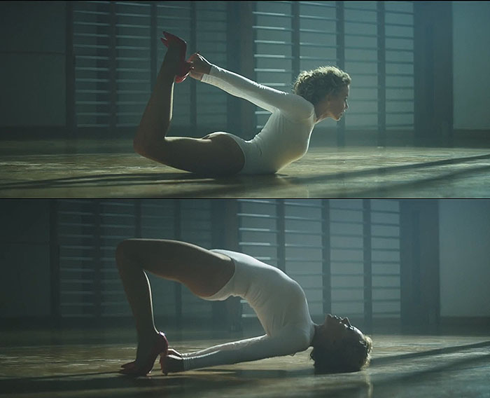 Kylie Minogue 'Sexercize' music Kylie Minogue demonstrates various yoga poses in a white body suit during her "Sexercize" music video