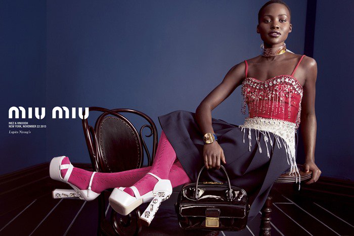 Lupita Nyongo modeling the Miu Miu jeweled-heel platform sandals in the label's Spring 2014 campaign