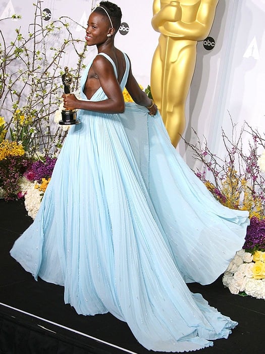 Lupita Nyong'o's gown, a collaborative creation between Nyong'o and the design expertise of Prada, was styled by Micaela Erlanger