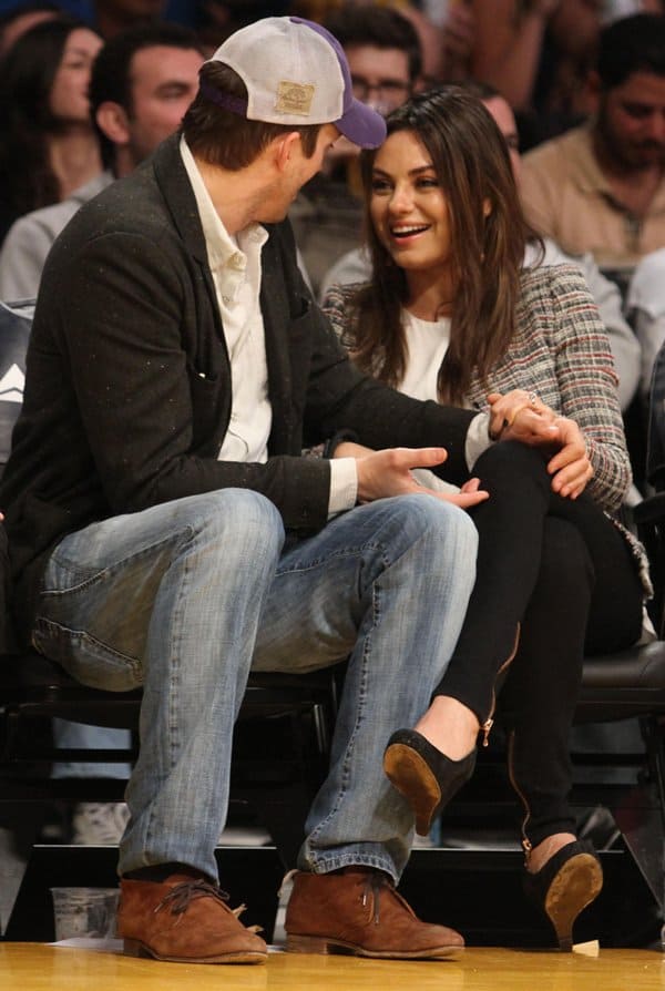 Mila Kunis and Ashton Kutcher beam with joy after announcing their engagement in February 2014