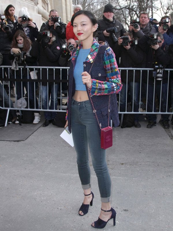 Rila Fukushima in an adorable tweed jacket attends the Chanel show