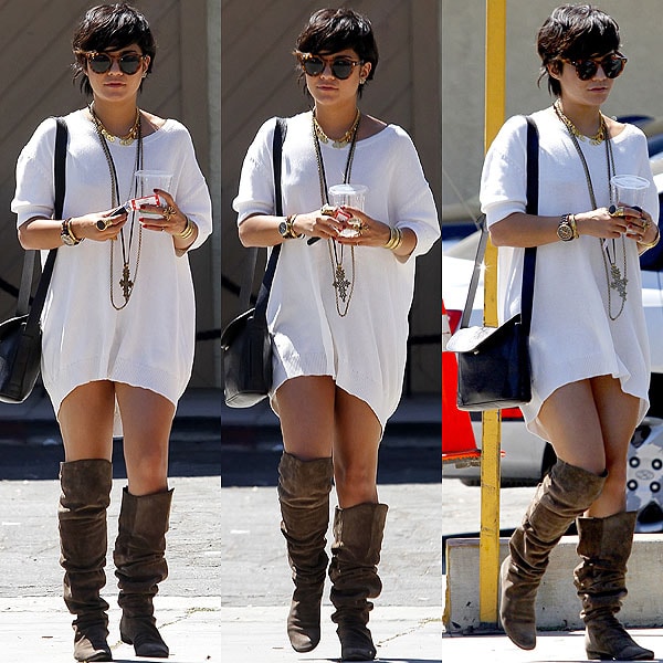 Vanessa Hudgens pairs a baggy sweater dress with layered jewelry and slouchy suede boots