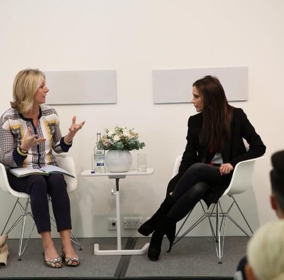 Susie Forbes and Victoria Beckham conversing during a Q&A classroom discussion at the Condé Nast College of Fashion & Design in London, England, on March 12, 2014