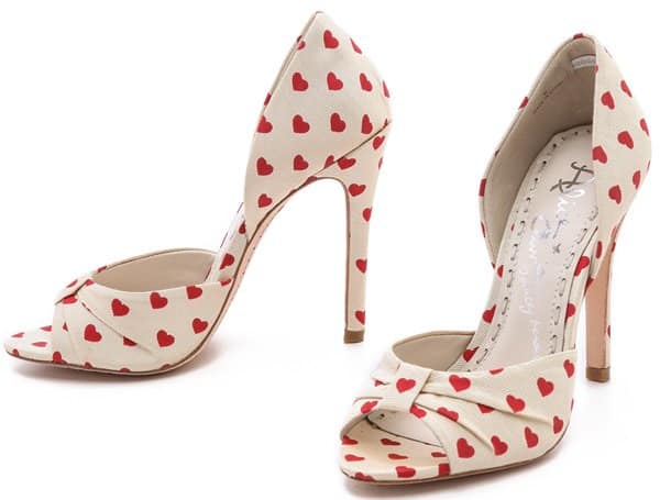 The Alice + Olivia Gigi Heart Print d'Orsay Pumps add a playful and romantic touch with their charming red heart pattern, perfect for completing any stylish outfit