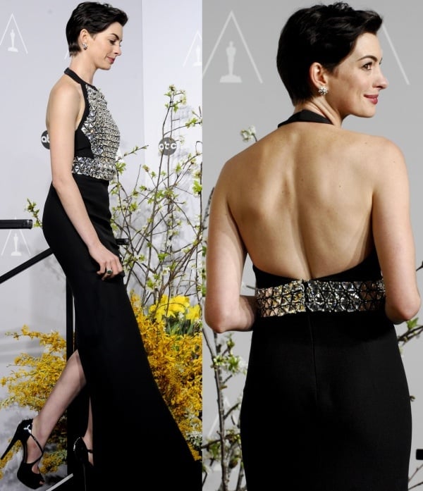 Anne Hathaway wore the "Lili" pumps from Gucci, which feature open toes, crossover straps, covered platforms, and black patent leather