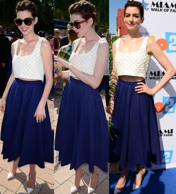 To complement her outfit, Anne Hathaway opted for white-and-tan Gianvito Rossi pumps, adding a touch of sophistication