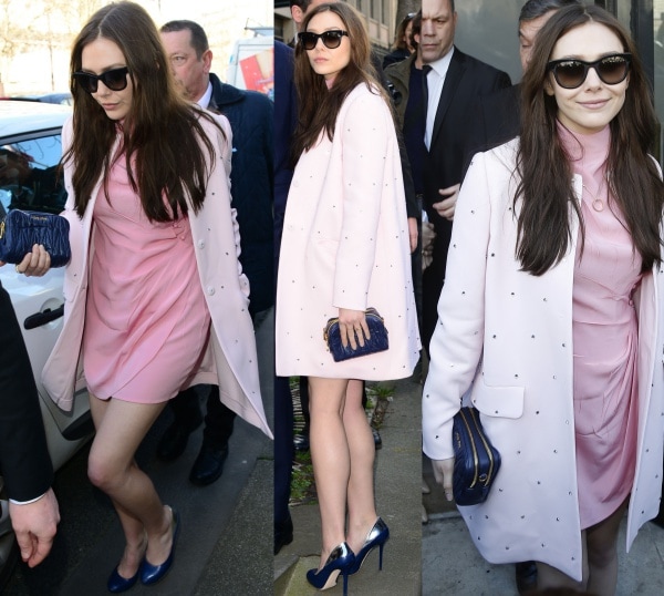 Elizabeth Olsen looked effortlessly chic arriving at the Miu Miu Fall/Winter 2014 show during Paris Fashion Week, wearing a blush pink dress, embellished baby pink coat, navy clutch, and matching navy heels