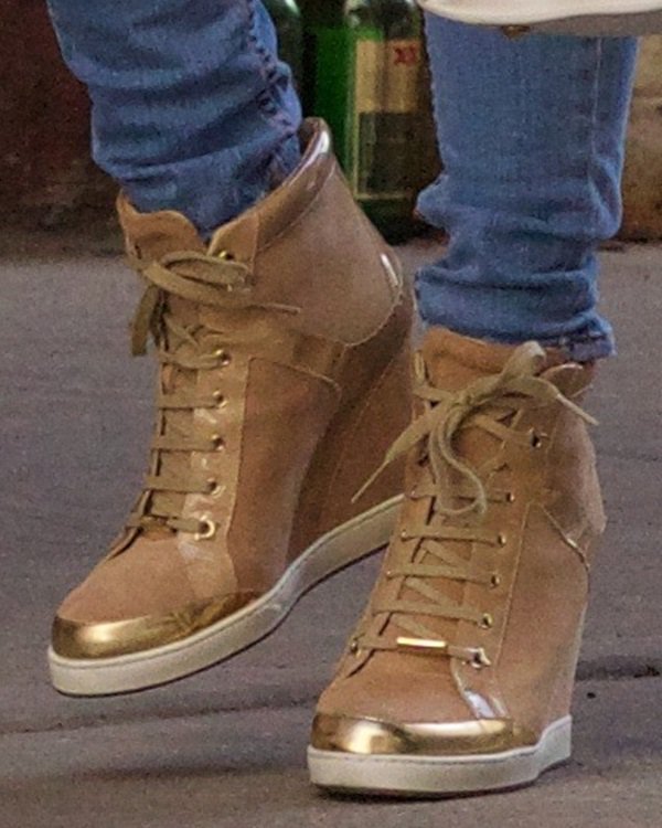 Jessie J wearing Jimmy Choo gold-detailed sneakers