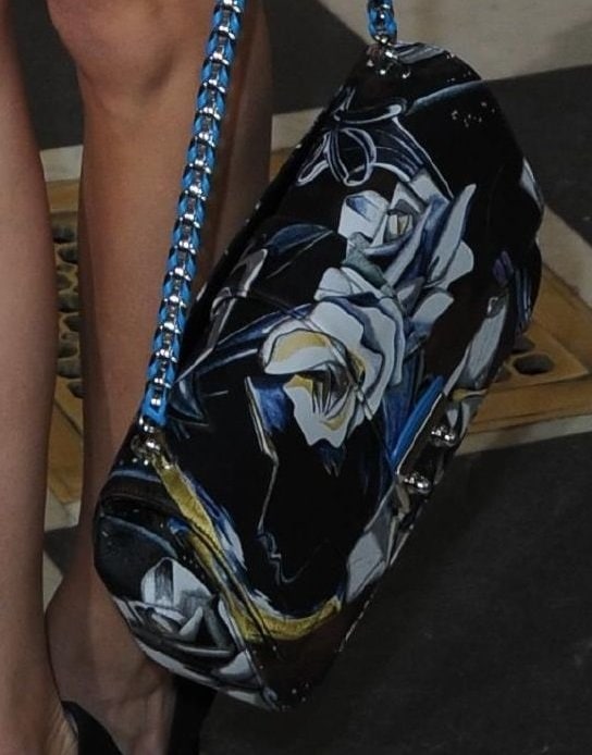 A closer look at Olivia's statement purse — the Miss Dior bag in floral print