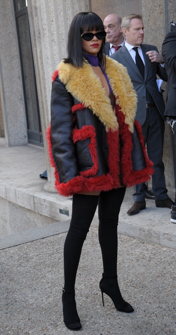 Rihanna in thigh-high socks paired with matching black ankle-strap sandals