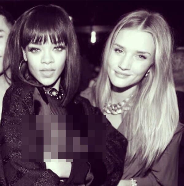 Rihanna posing with supermodel Rosie Huntington-Whiteley in a risque outfit