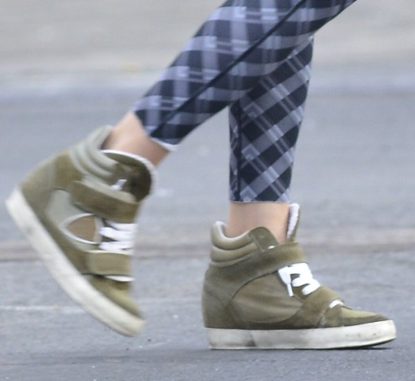 Sarah Jessica Parker in printed pants and olive green wedge sneakers