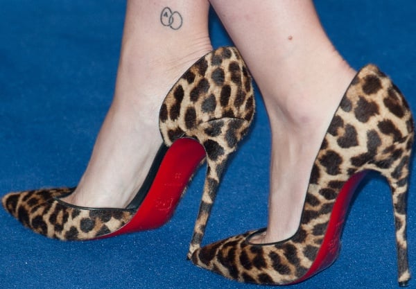 Scarlett Johansson steps out in bold leopard-print Christian Louboutin "Iriza" pumps, featuring the brand’s signature red soles and a sleek d'Orsay silhouette