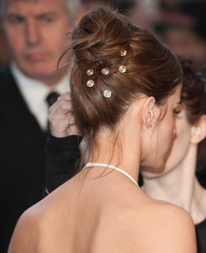 Emma Watson adds silver studs to her hair as part of her "Noah" premiere updo