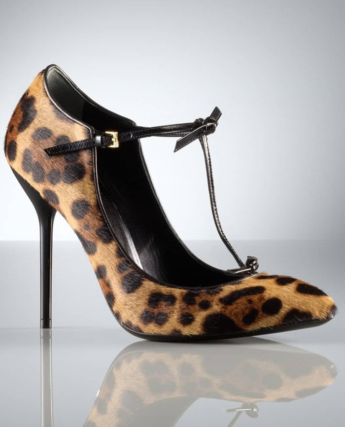 Trim twists detail the patent-leather T-strap of a leopard-patterned pump crafted from lush calf hair with a polished Gucci logo plate under the arch