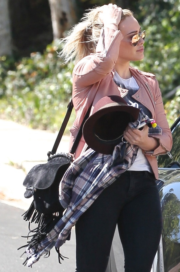 Hilary Duff holds her hair back from the wind as she heads to a friend's house in Los Angeles.
