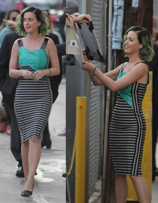 Katy Perry greets fans while flaunting her curves in a mixed-media bodycon dress, complemented by sleek black pumps and bold green hair highlights as she departs Jimmy Kimmel Live! in Hollywood