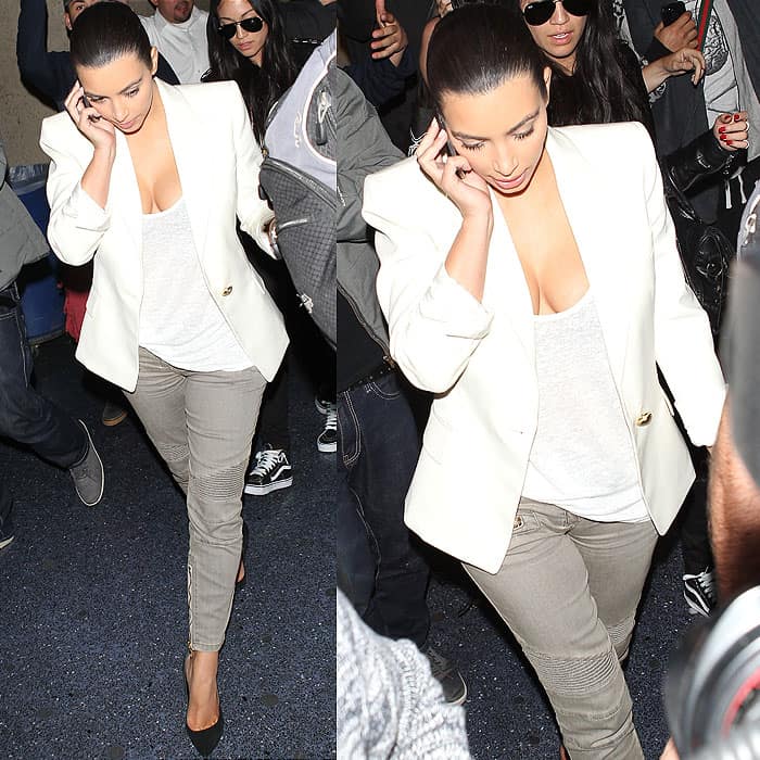 Kim Kardashian wearing a Balmain blazer, t-shirt, and gray jeans