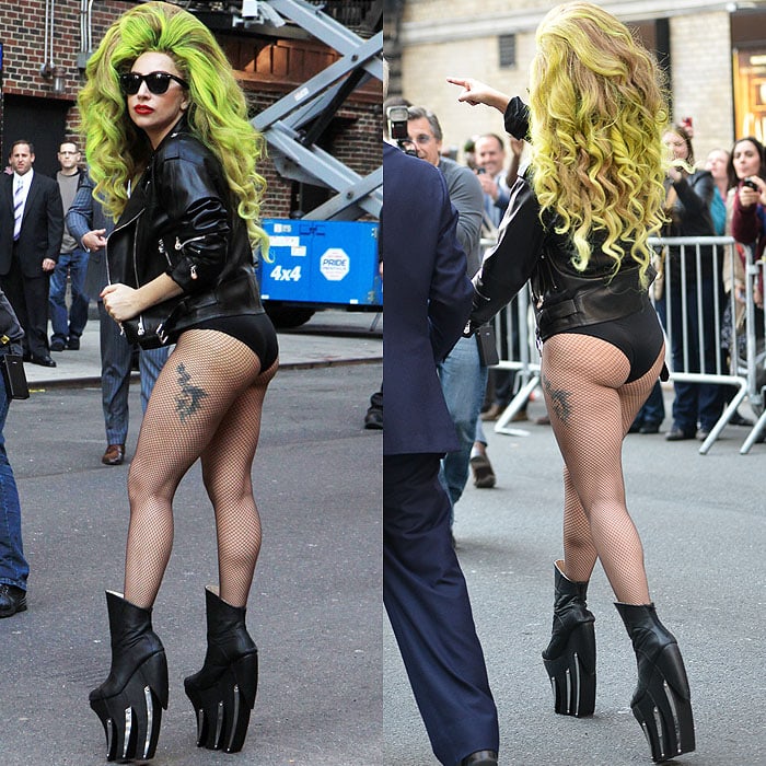 Lady Gaga showcases her distinctive black metal-plated boots paired with her signature pantless style as she gracefully poses before entering the 'Late Show with David Letterman' studios
