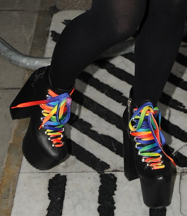 Lily Allen in black boots with striking rainbow laces