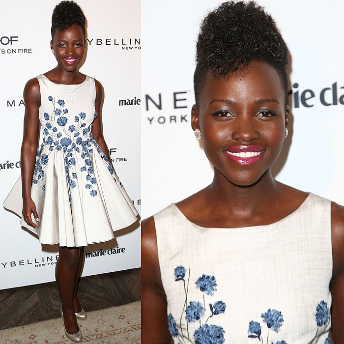 Lupita Nyong'o stuns in a Giambattista Valli dress adorned with blue floral embroidery, paired with classic Christian Louboutin "Fifi" pumps