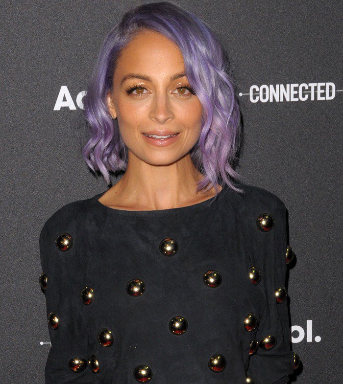 Nicole Richie slipped into a short black studded shift with side cutouts