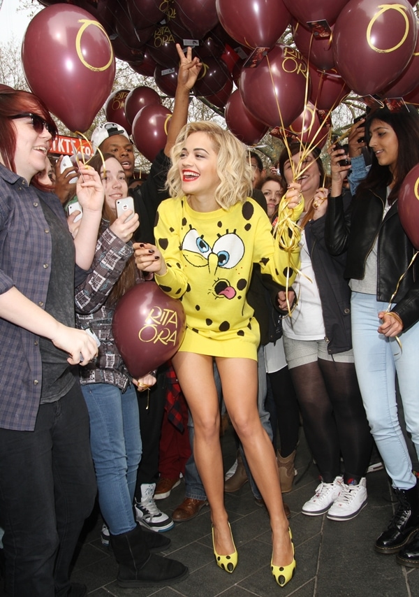 Rita Ora wearing a yellow Spongebab Squarepants jumper dress