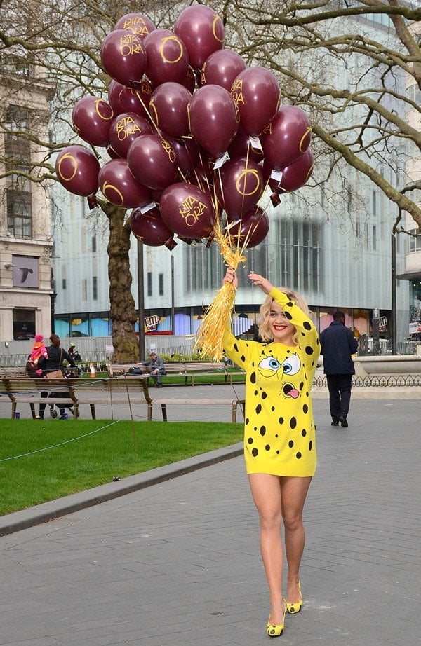 Rita Ora with a handful of balloons to celebrate with her fans