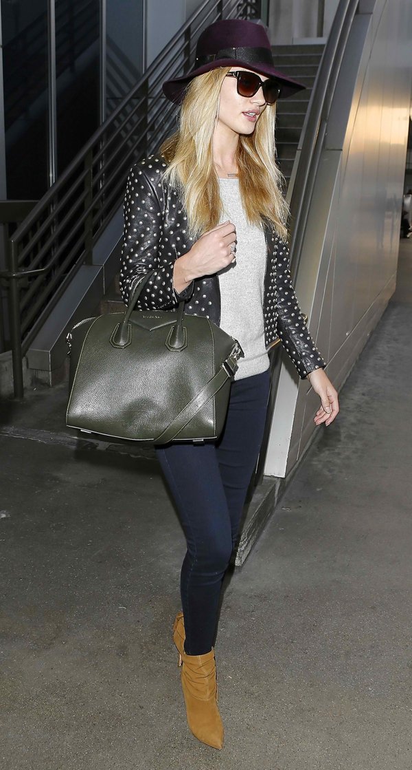 Rosie Huntington-Whiteley stuns in dark denim jeans at LAX airport on April 18, 2014