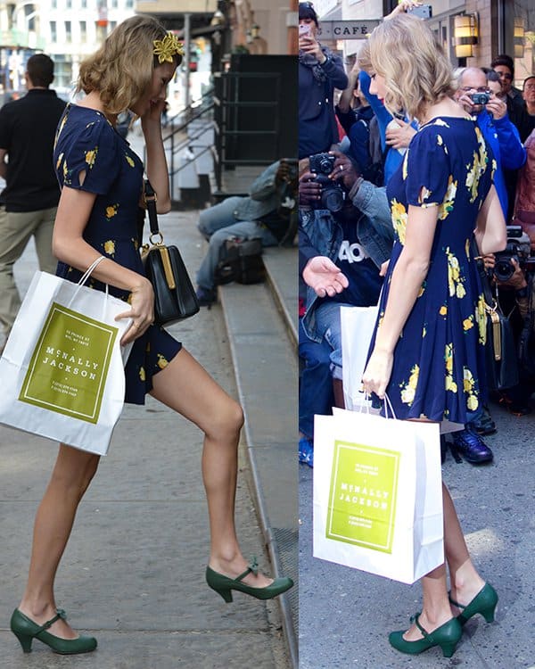 Taylor Swift accessorizes her chic floral dress with a classic black handbag and a charming golden poinsettia headband, completing her elegant look in New York City