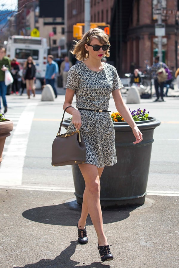 Taylor Swift demonstrates how to cinch your waist with a floral vintage dress