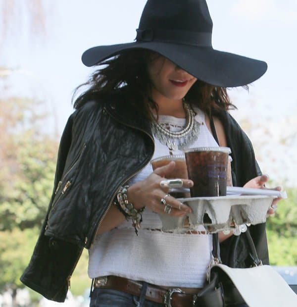 Vanessa Hudgens tries to go undetected wearing an oversized hat as she grabs iced coffees in Los Angeles on March 31, 2014