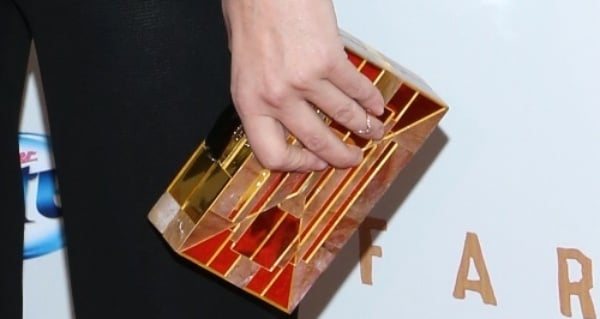 Diane Kruger totes a gold box clutch