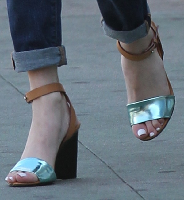 Emma Roberts's feet in block-heeled ankle-strap sandals