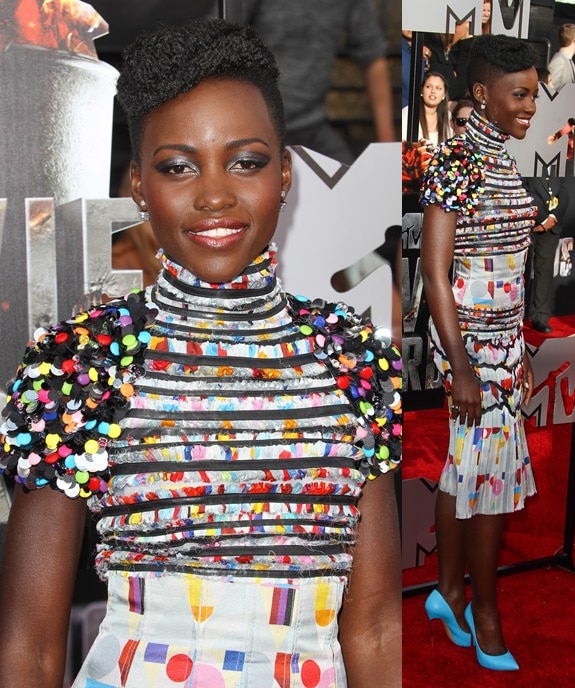 Lupita Nyong'o capping off her colorful dress with bright blue Casadei pumps