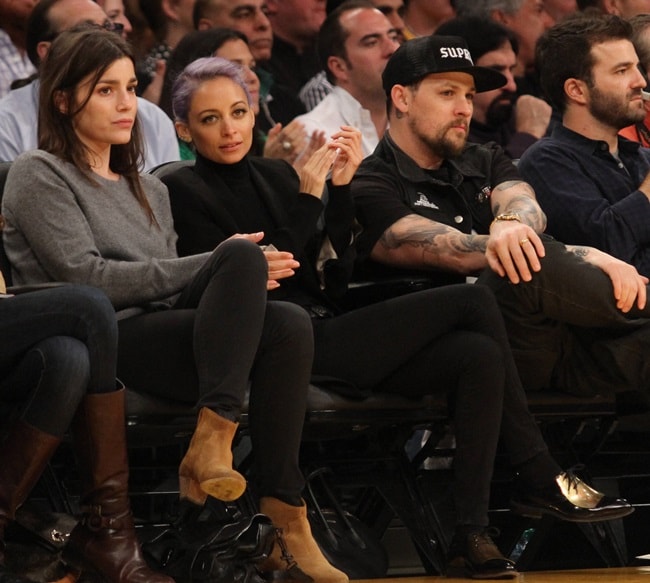 Nicole Richie wearing Celine metal plate oxfords to the Lakers vs. Blazers game in Los Angeles on April 1, 2014