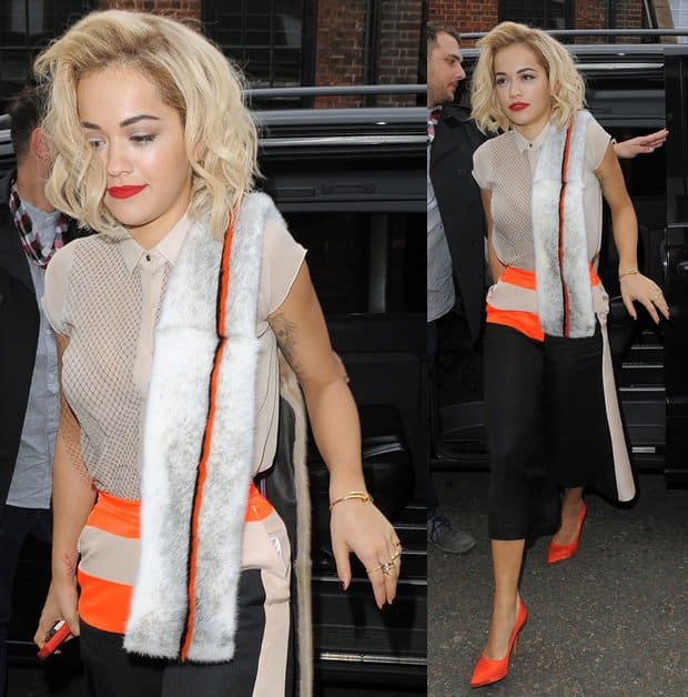 How Rita Ora Wears Orange-Paneled Culottes With Fur Scarf