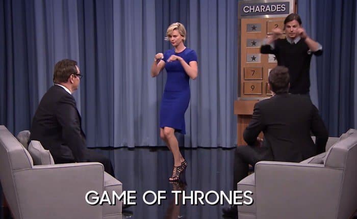 Charlize Theron in a Stella McCartney dress and Christian Louboutin shoes playing a game of charades on 'The Tonight Show Starring Jimmy Fallon'