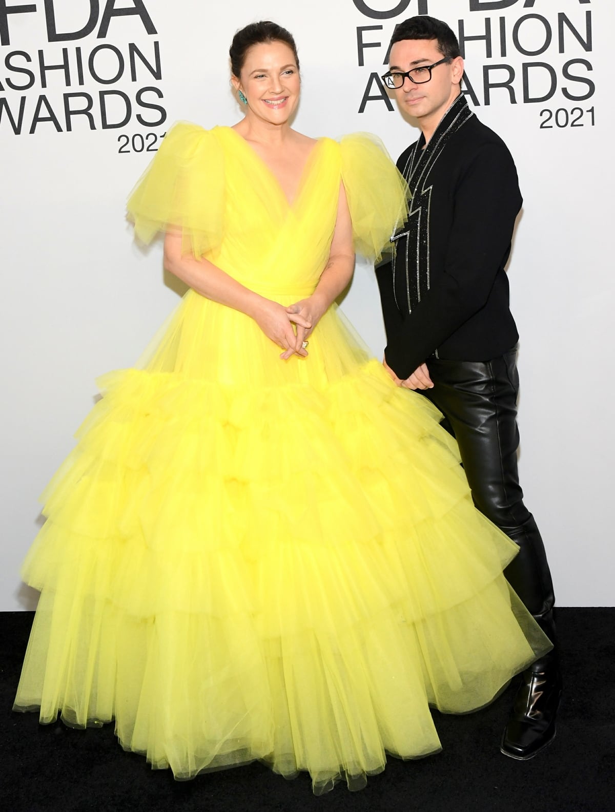 Drew Barrymore and the designer of her canary yellow tulle gown, Christian Siriano, at the 2021 CFDA Fashion Awards