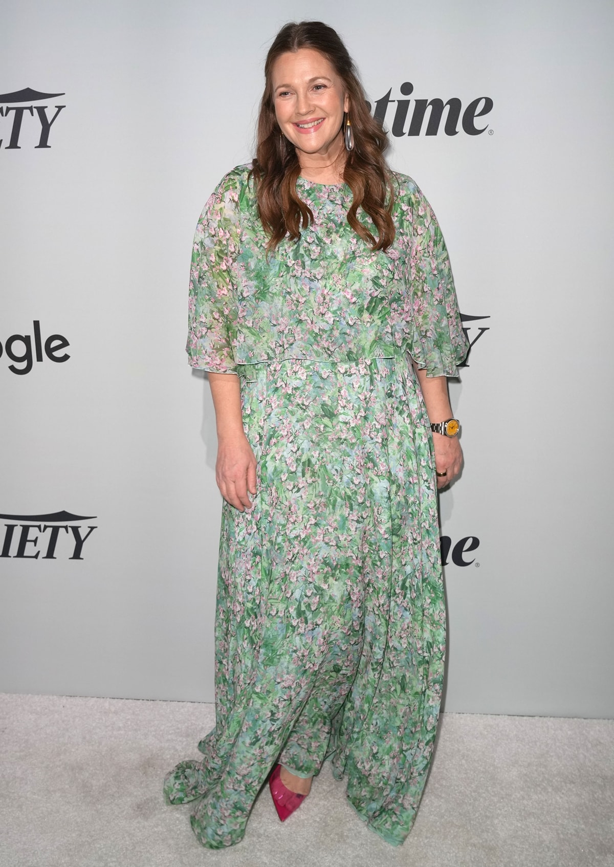 Drew Barrymore in a floral Giambattista Valli dress crafted of silk with flowy drape sleeves for Variety’s 2022 Power Of Women event